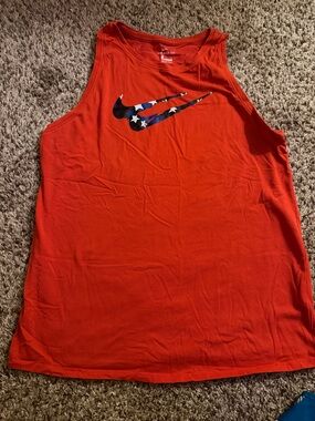 Nike Orange Sleeveless Tank with Star-Patterned Swoosh